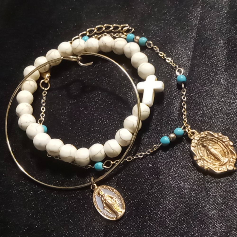 Three Christian bracelets 1 howlite cross & 2 mother Mary charmed
